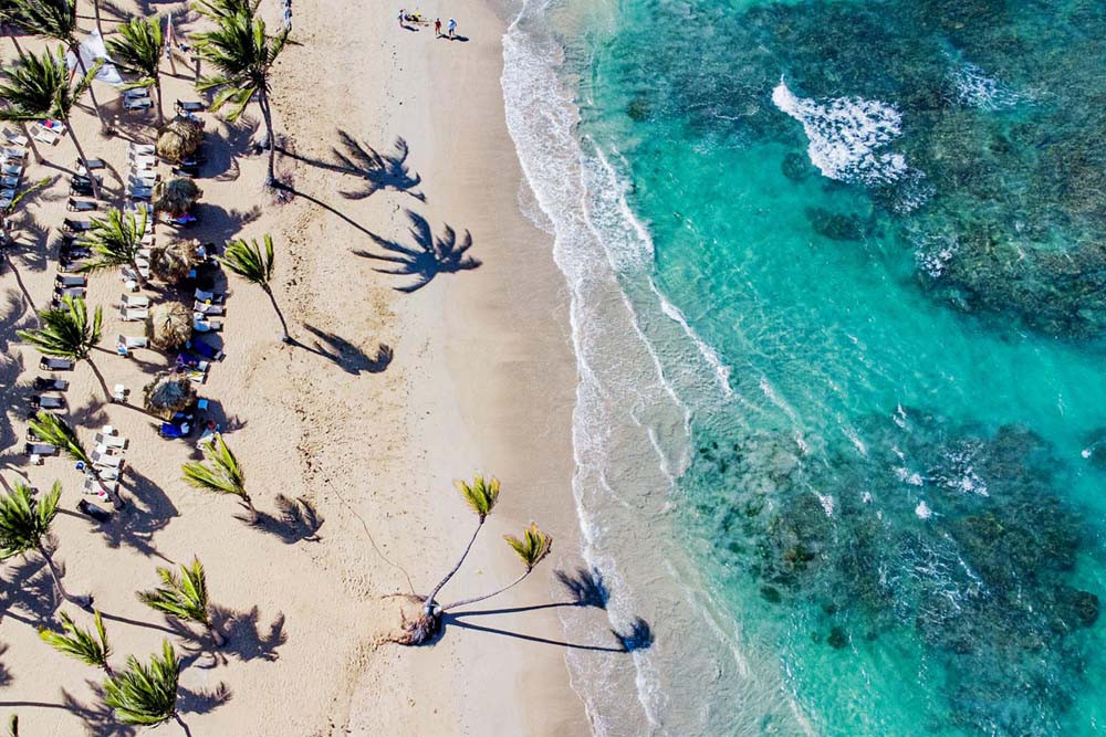 Aerial view of Playa Palmera Beach Resort's private piazza and coastline