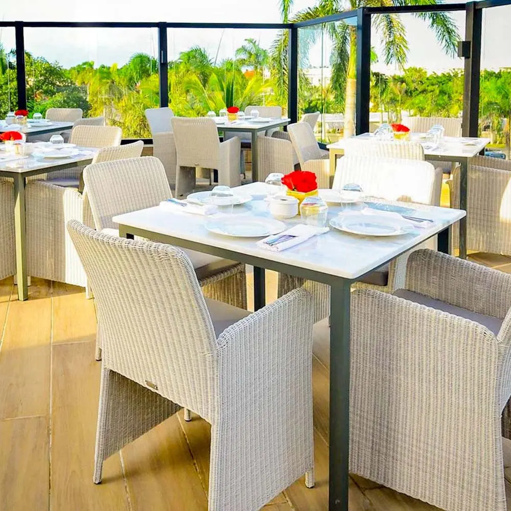 Tables on the terrace of the Florecita restaurant at Playa Palmera Beach Resort