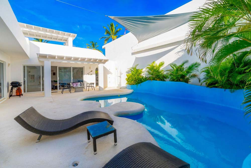 Lounging by the private pool in a villa at Playa Palmera Beach Resort