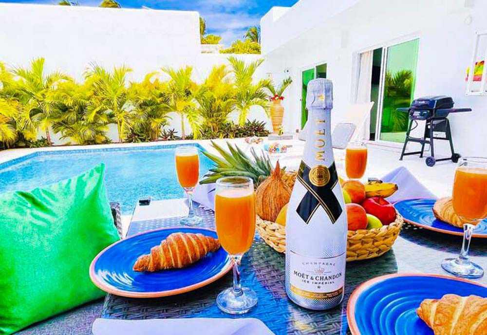 Champagne, drinks, snacks and pool views in a villa at Playa Palmera Beach Resort