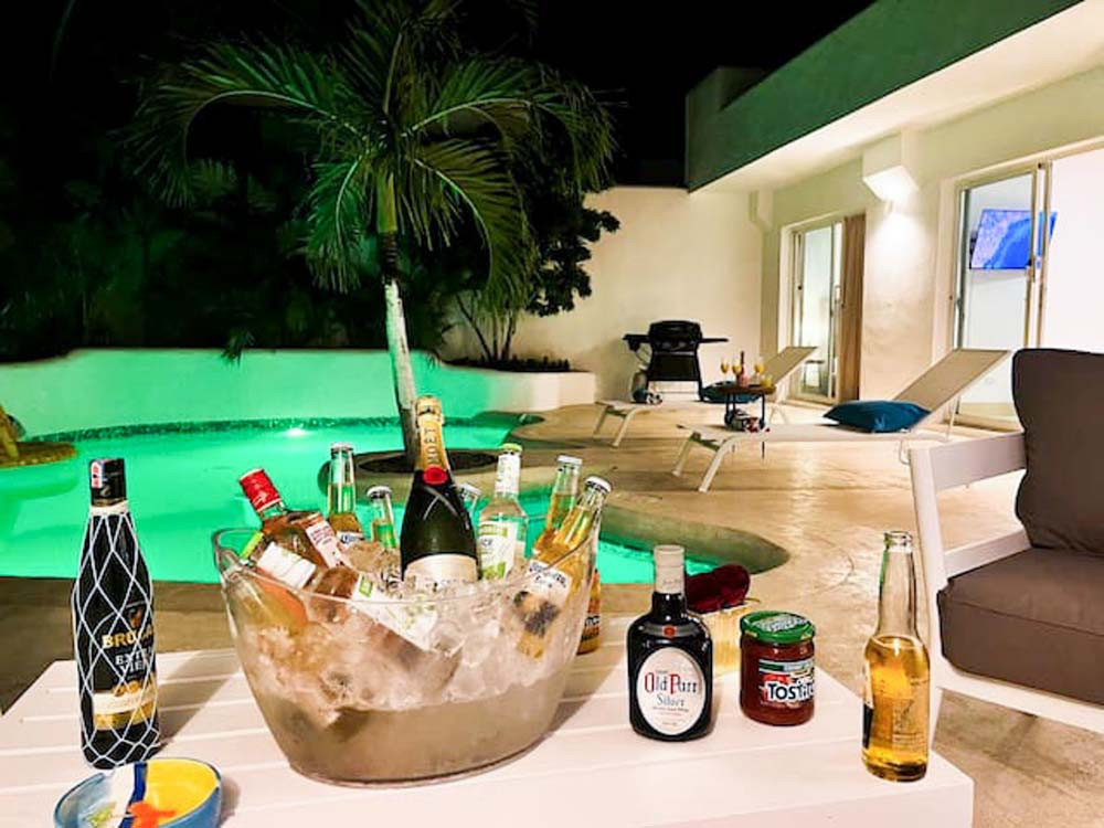 Drinks by the pool at night in a villa at Playa Palmera Beach Resort