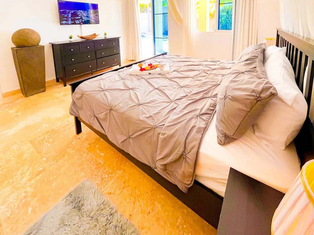 A spacious bedroom in a villa at Playa Palmera Beach Resort
