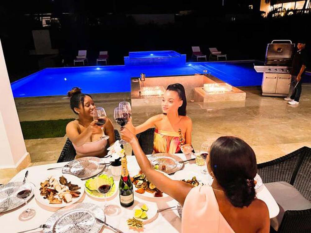 Evening gathering by the pool at a villa in Playa Palmera