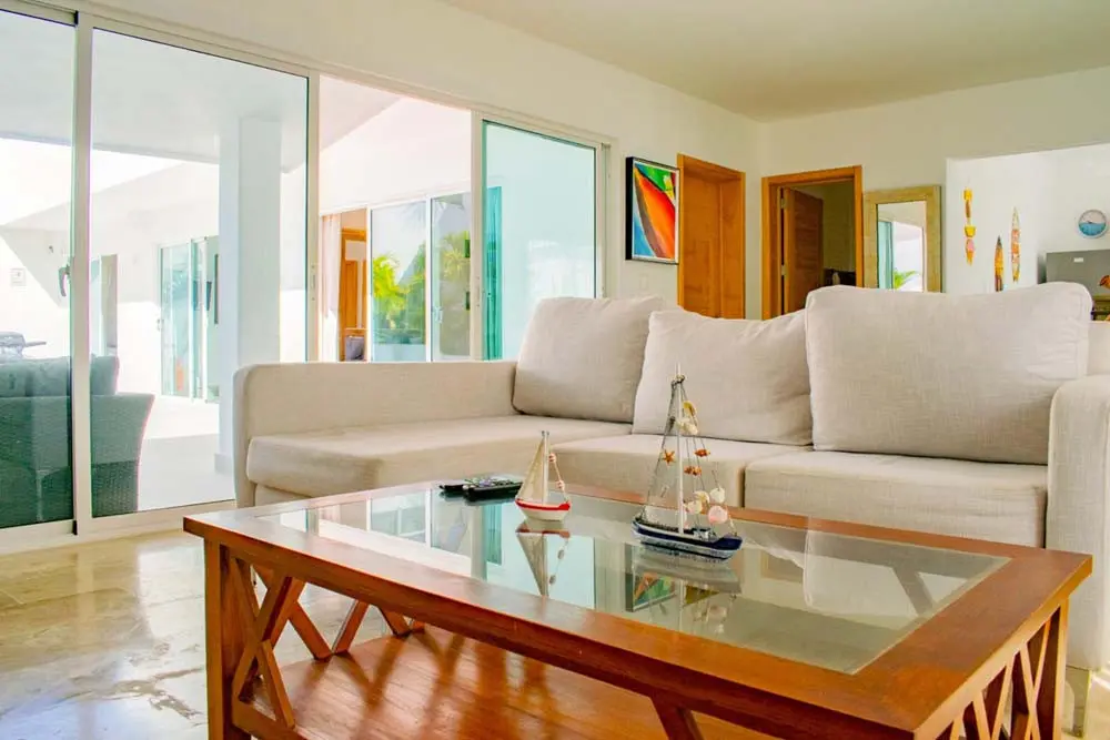 Sofa in the living room of the villa at Playa Palmera Beach Resort