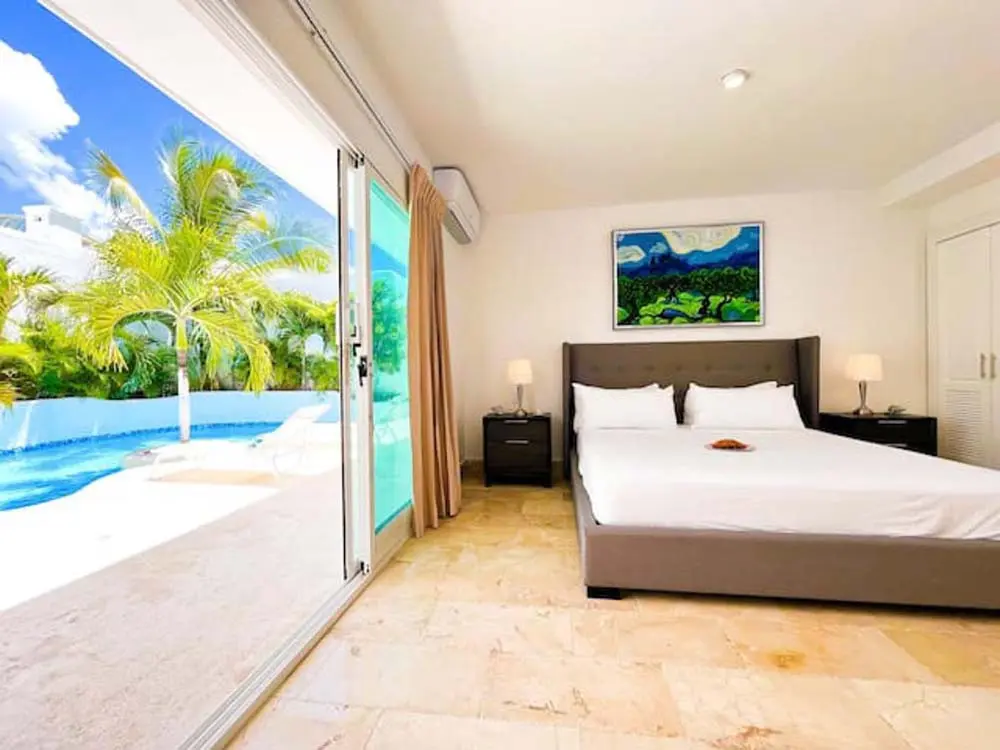 Luxury bedroom in a villa at Playa Palmera Beach Resort