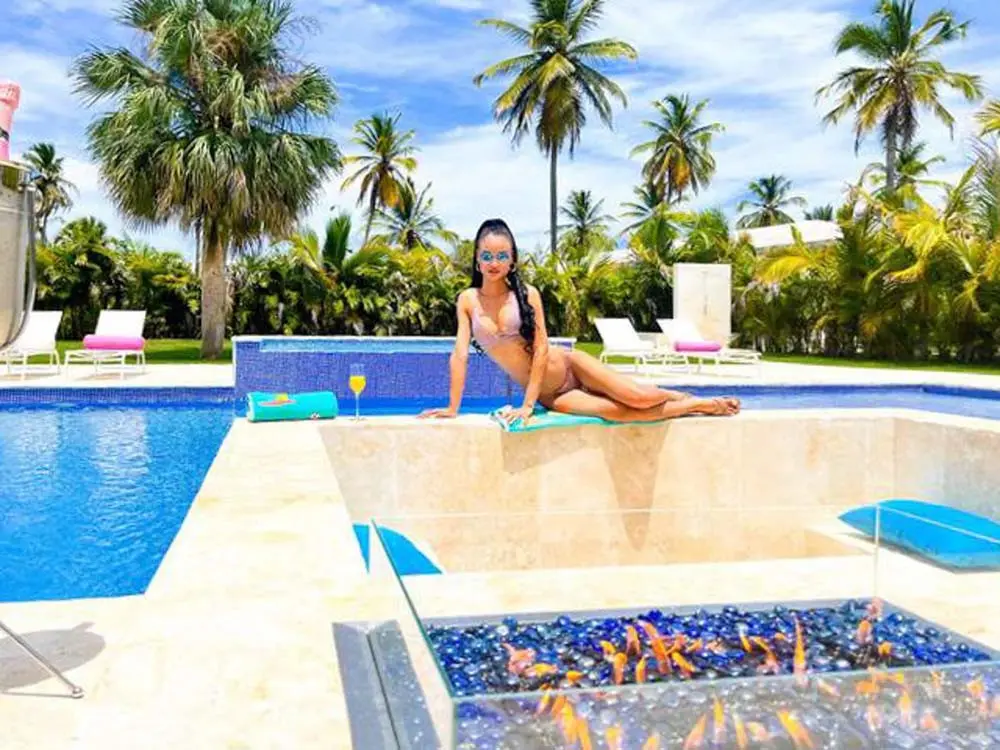Woman by the pool at a villa in Playa Palmera