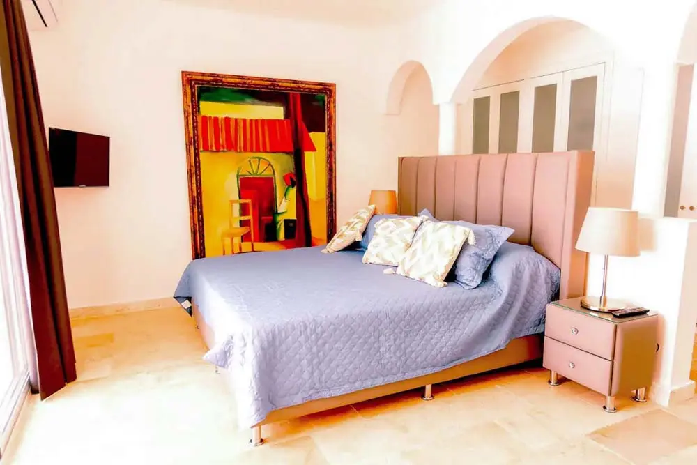 Elegant bedroom in a villa at Playa Palmera Beach Resort