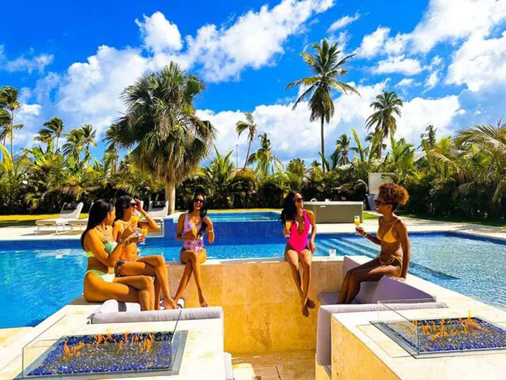 A meeting with friends by the pool in a villa at Playa Palmera Beach Resort