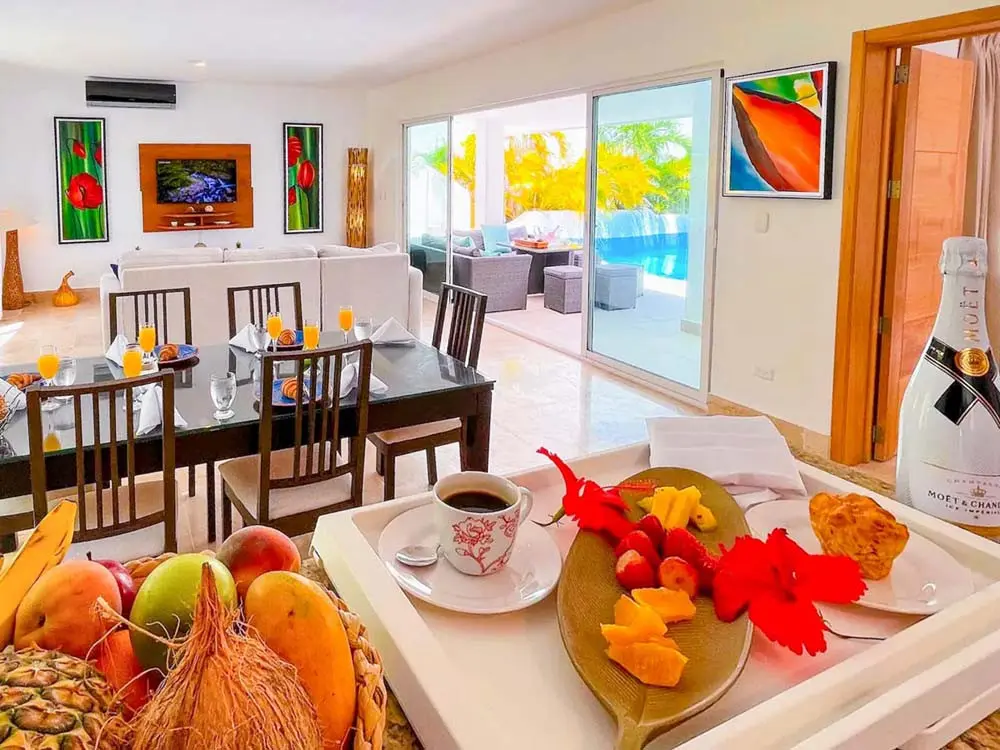 View from the kitchen to the dining and living room in the villa at Playa Palmera Beach Resort